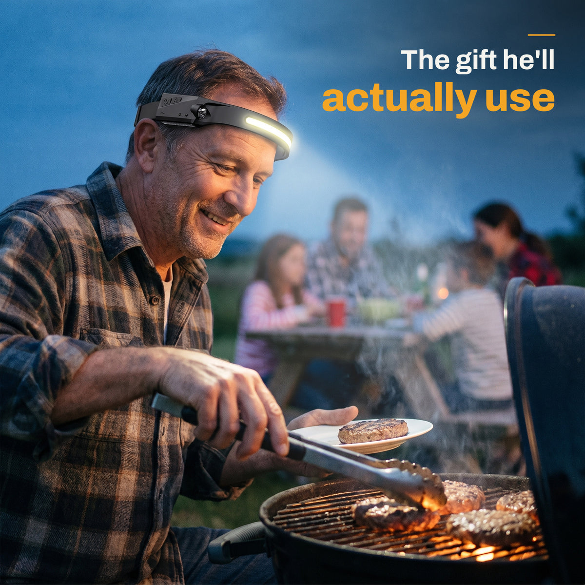 Man grilling burgers at dusk wearing the HaloBeam headlamp