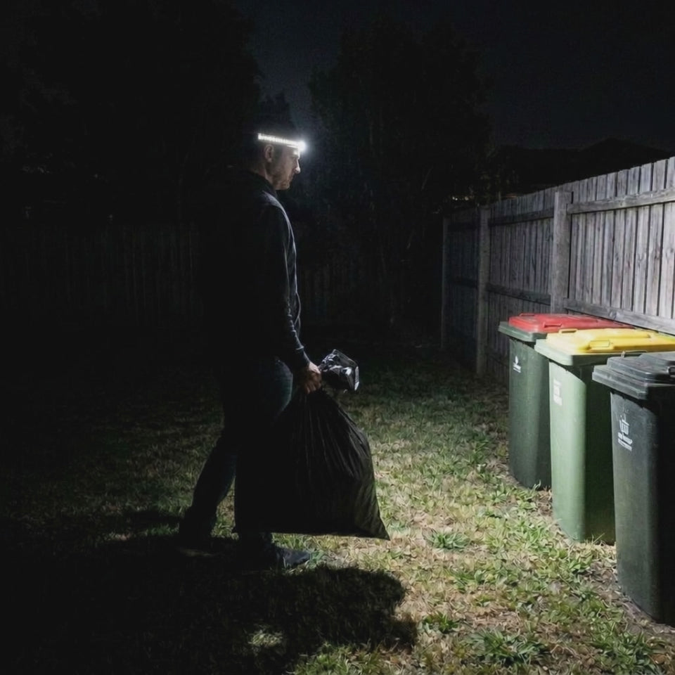 Taking out the trash at night, the HaloBeam lights only where he looks